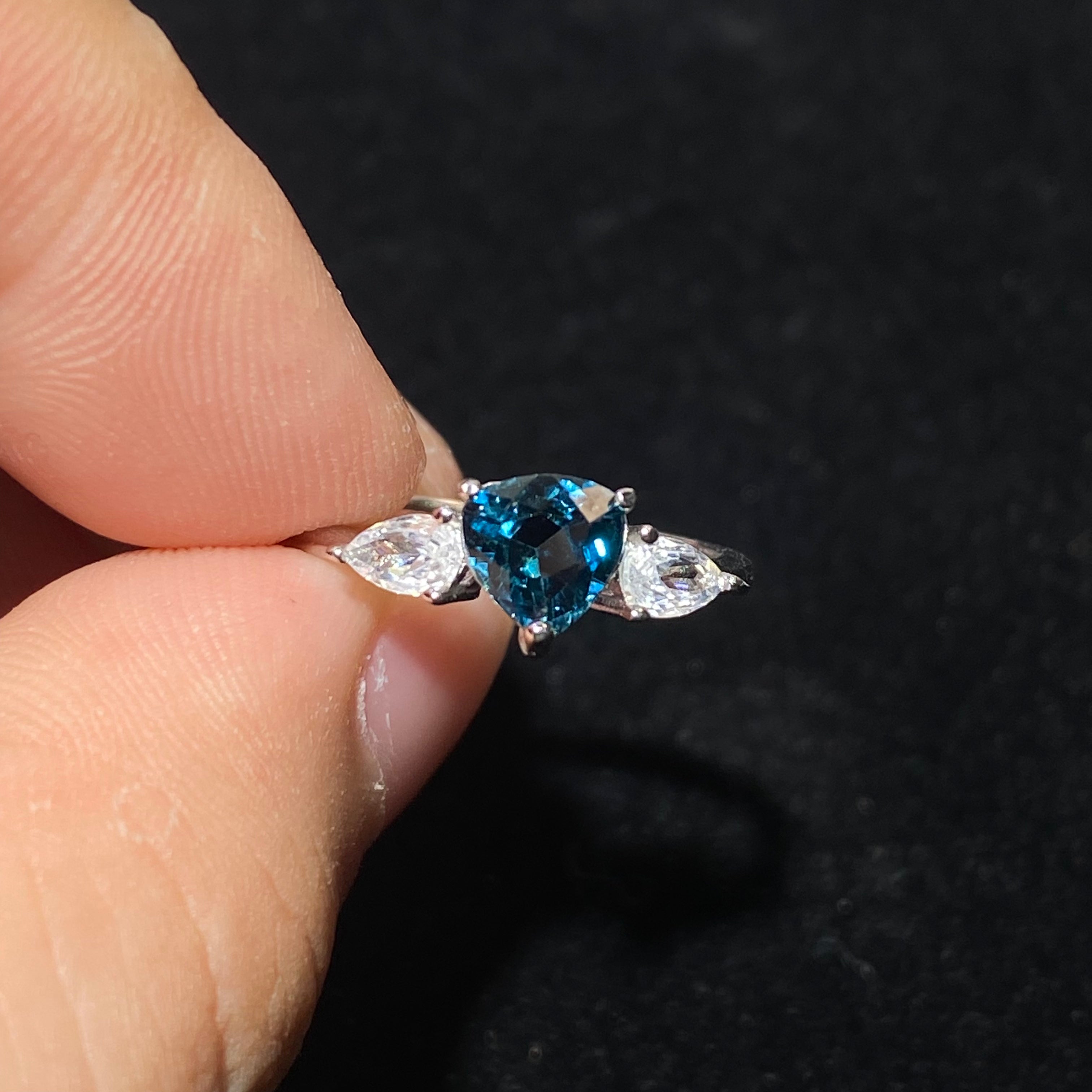 Pear London Blue Topaz Three-Stone Split Shank 925 Sterling Silver Ring Deep ocean blue teardrop main gem flanked by marquise clear zircon accent stones