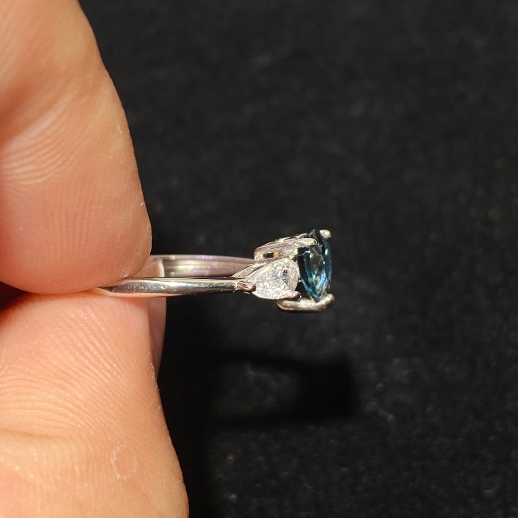 Pear London Blue Topaz Three-Stone Split Shank 925 Sterling Silver Ring Deep ocean blue teardrop main gem flanked by marquise clear zircon accent stones