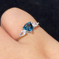 Pear London Blue Topaz Three-Stone Split Shank 925 Sterling Silver Ring Deep ocean blue teardrop main gem flanked by marquise clear zircon accent stones