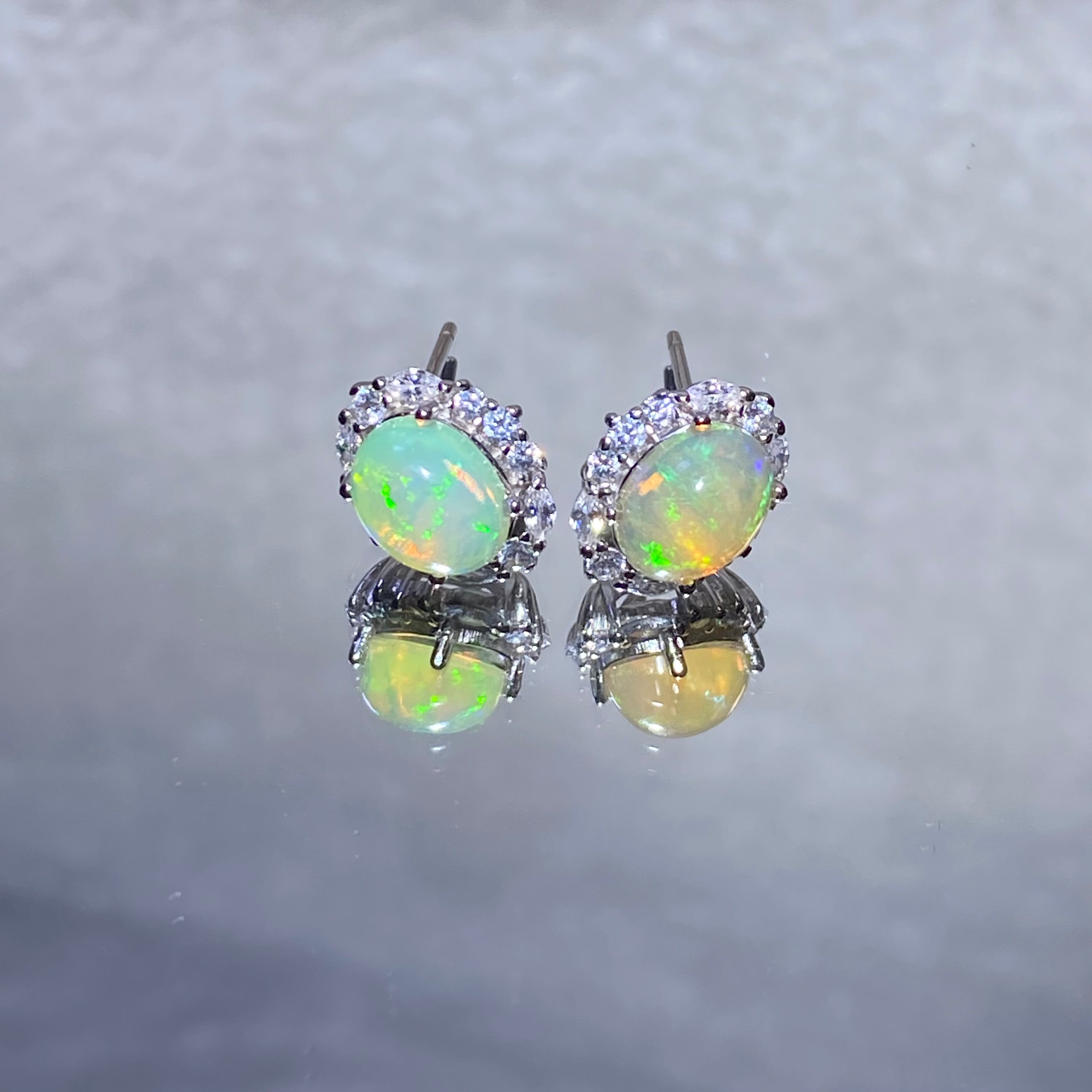 Oval Natural Rainbow Play-of-Color Ethiopian Opal Micro Pave Zircon Halo Stud Earrings Dreamy iridescent lightweight hypoallergenic daily & formal silver earrings