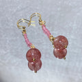 Oversize Natural Pink Strawberry Quartz Smooth Round Focal Bead Delicate Mini Pink Crystal Strand Gold Plated Fish Hook Long Dangle Earrings Heart Chakra Love Attraction Soft Sweet Romantic Pastel Pink Lightweight Crystal Drop Earrings