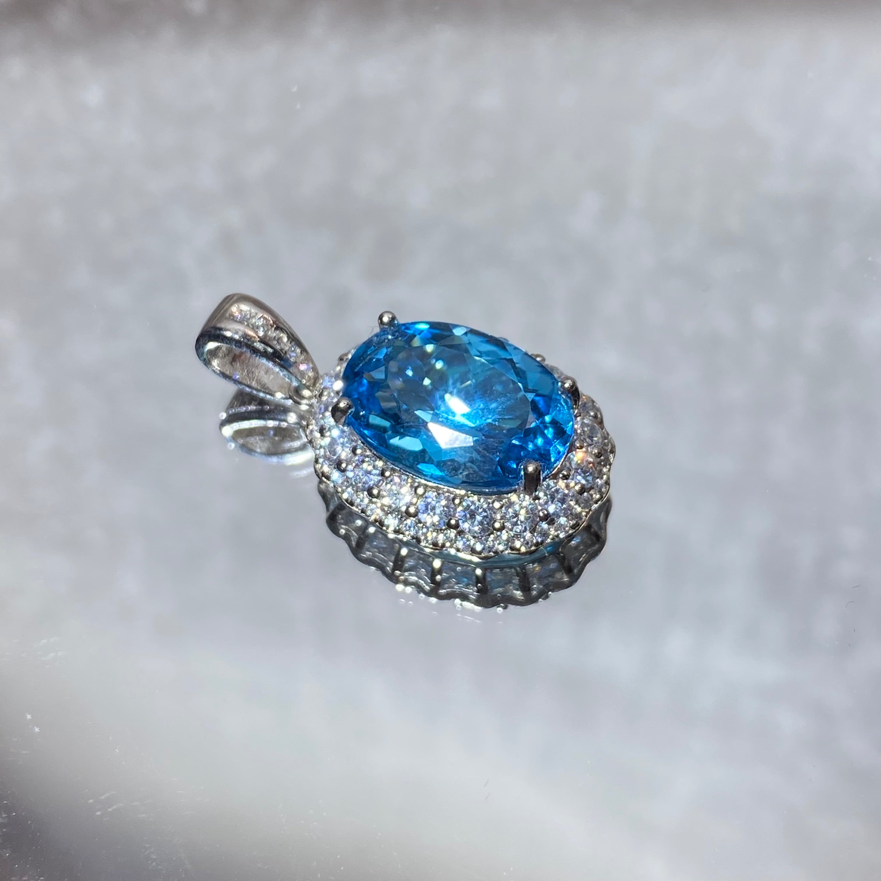 Swiss Blue Topaz Oval Halo Pendant