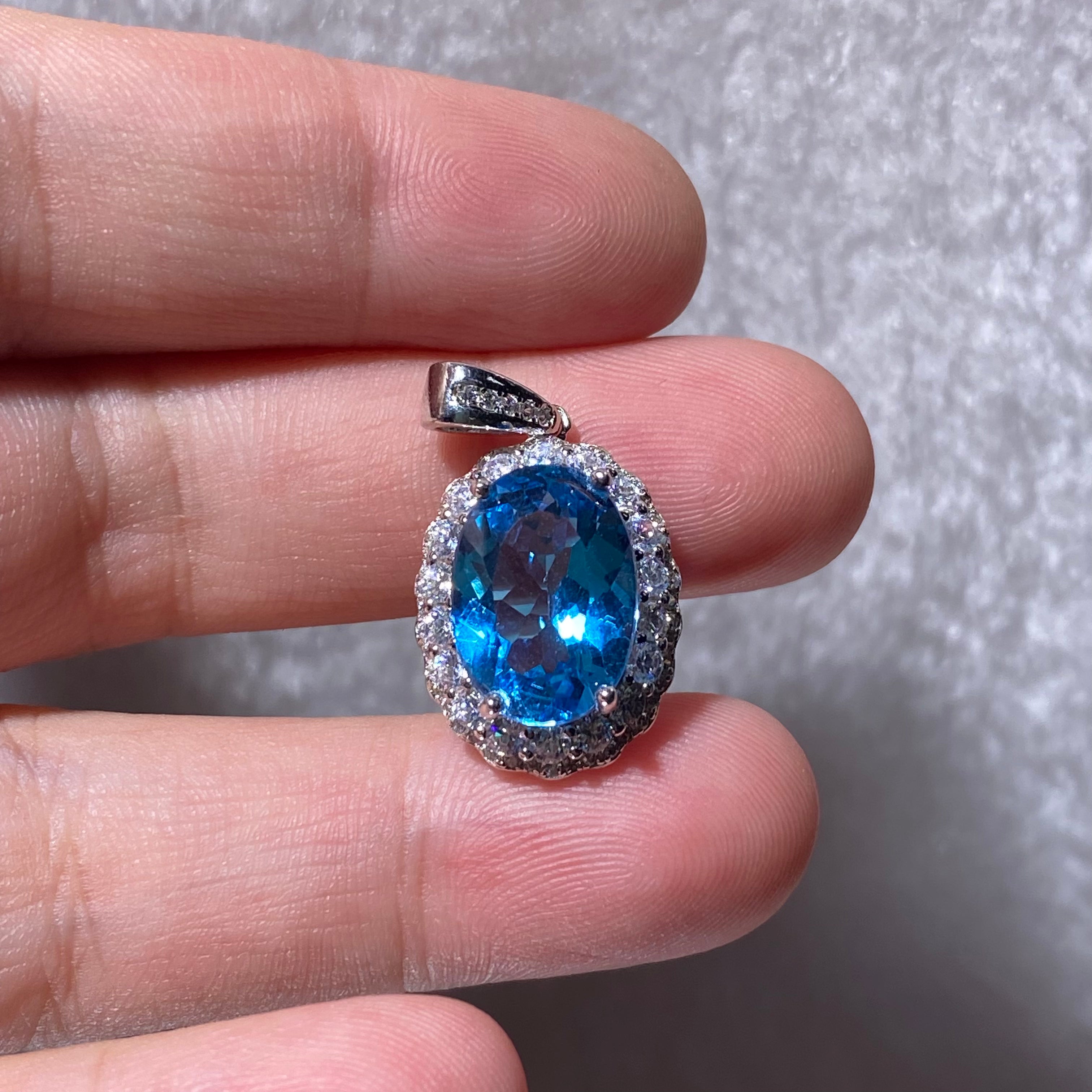 Swiss Blue Topaz Oval Halo Pendant