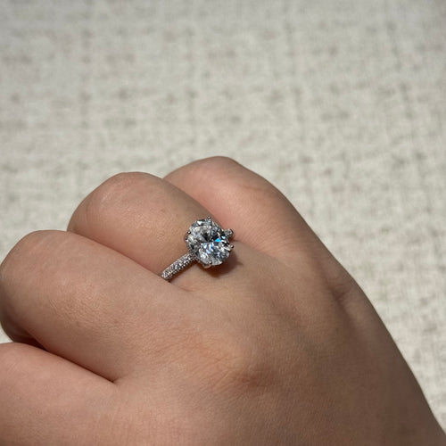 4-Prong Round Solitaire Ring with Paved Side Stones