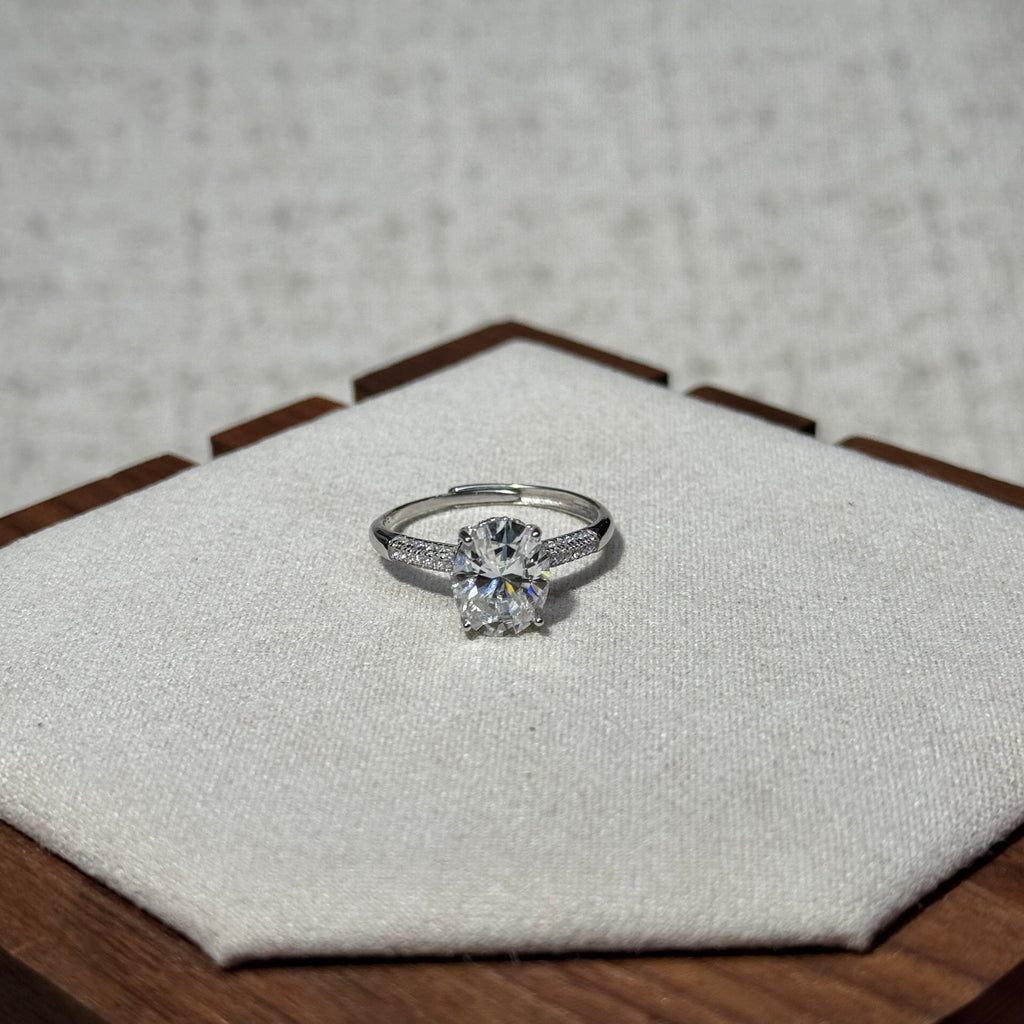 4-Prong Round Solitaire Ring with Paved Side Stones