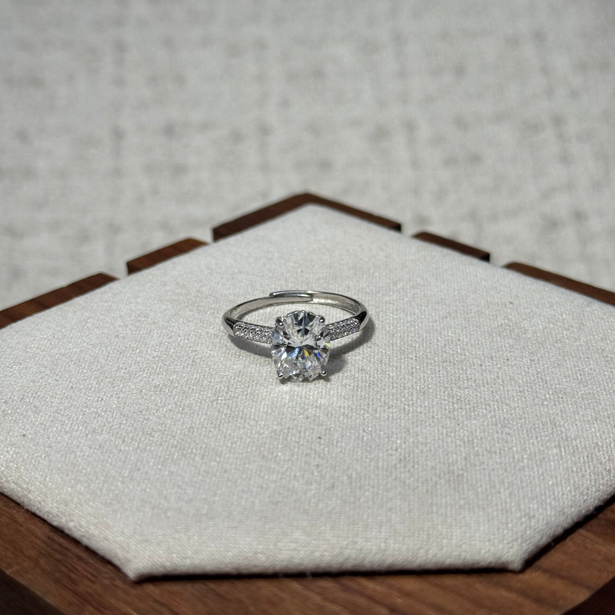 4-Prong Round Solitaire Ring with Paved Side Stones