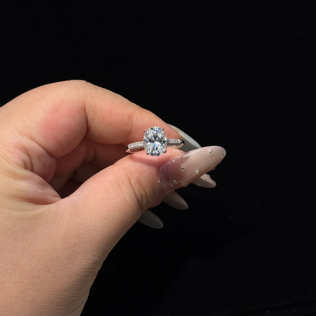4-Prong Round Solitaire Ring with Paved Side Stones
