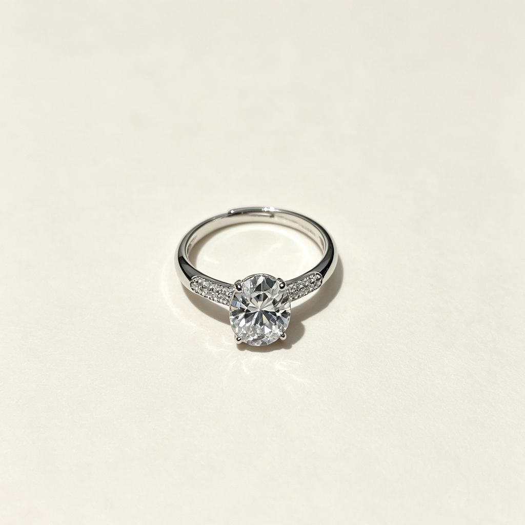 4-Prong Round Solitaire Ring with Paved Side Stones