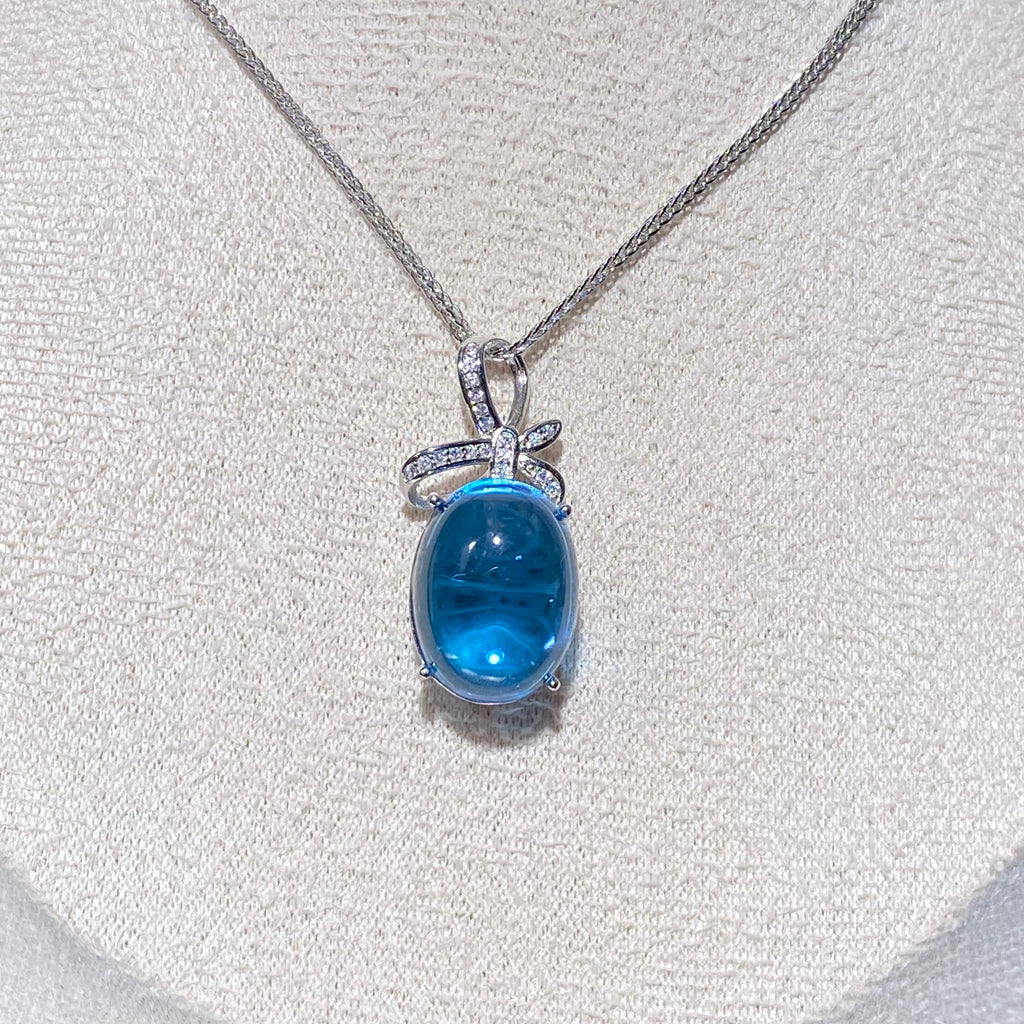 Swiss Blue Topaz Cabochon Pendant - Sterling Silver with Bow Design