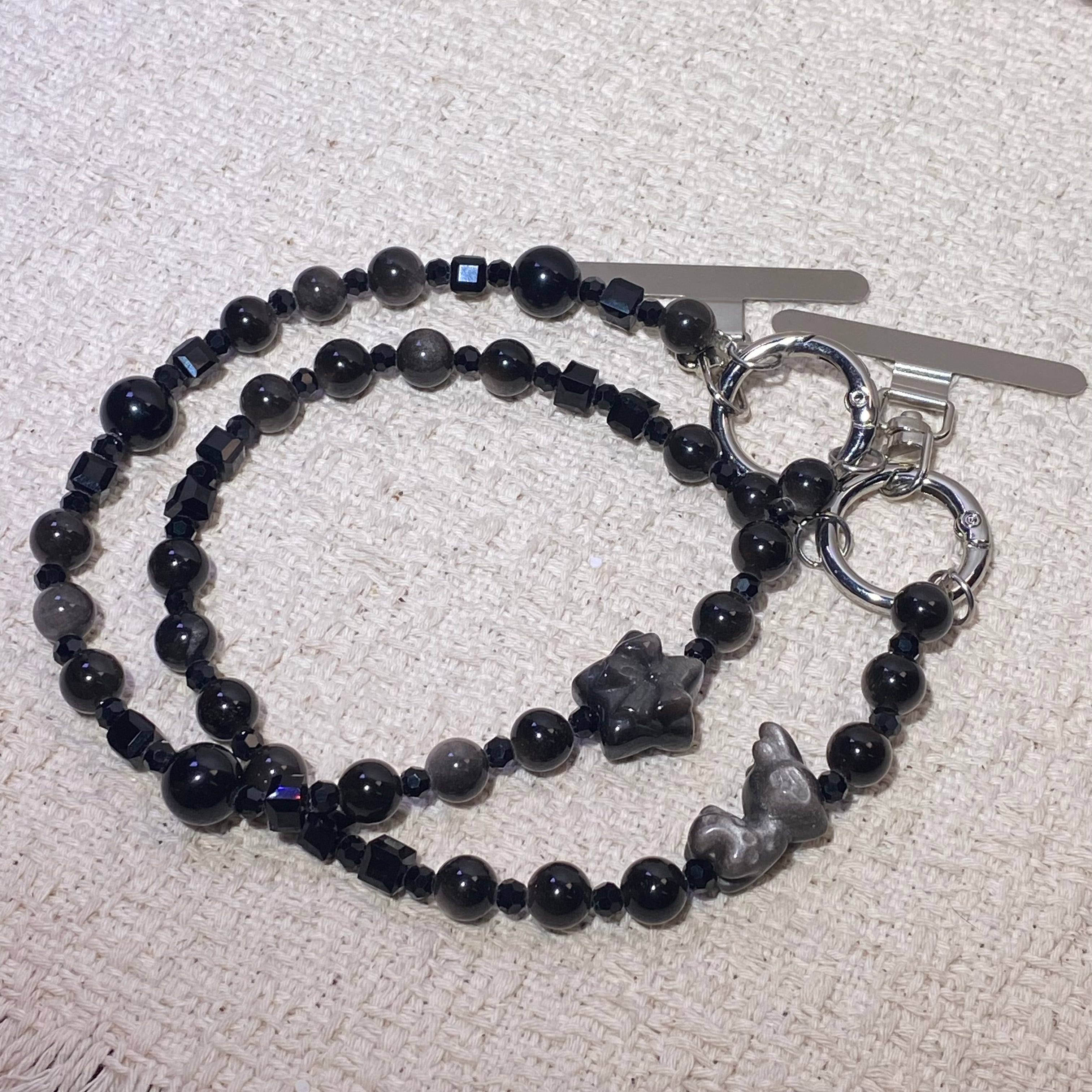 Silver Sheen Obsidian Bow & Rabbit Dual Use Beaded Bracelet / Bag Charm Glossy black silver flash obsidian bow rabbit carving mini bead wrist chain with toggle clasp